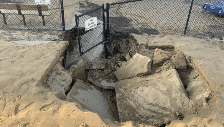 School playground closed after water main break causes sinkhole